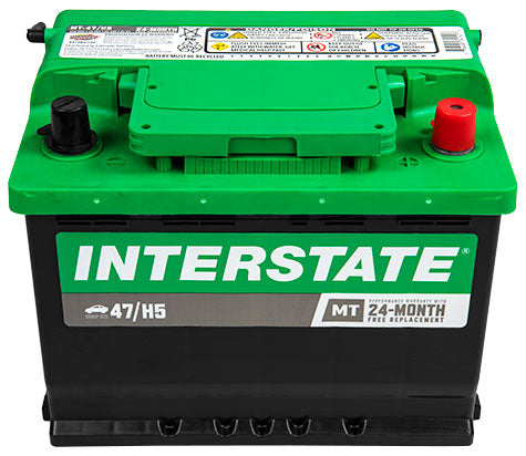 Black case battery with green top. Interstate logo