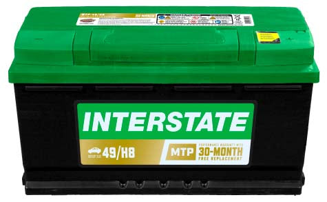 Car battery with Interstate label, green top whilte case.  Rescessed terminals with covers.