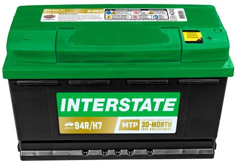 Black car battery with green top, recessed terminals, Interstate label