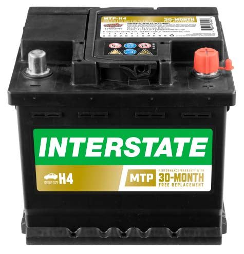 All black, small car battery with recessed terminals.  Interstate label