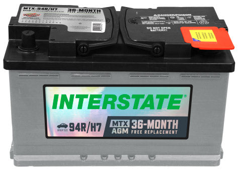 Battery with grey case and black top. Interstate label