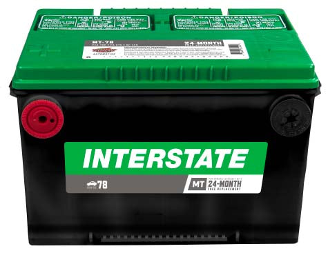 Black battery with green top, Interstate label, side terminals.