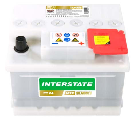 Small white car battery with Interstate V4 part number